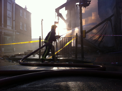 Fireman in action by Christophe Maximin